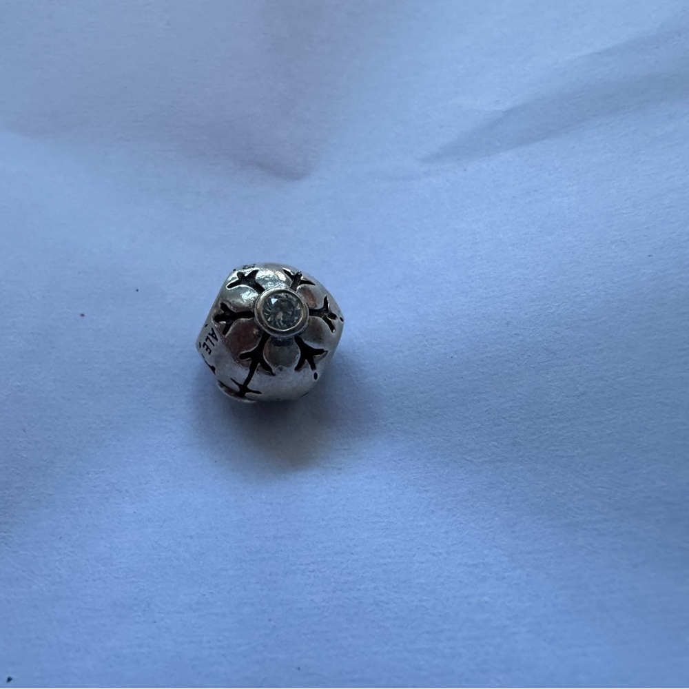 PANDORA Sterling Silver snowflake charm with light blue stones